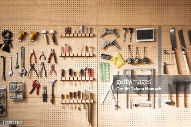 various tools arranged on the wall - hand tool foto e immagini stock