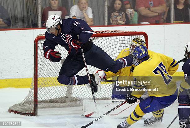 Emerson Etem of Team USA flies past Johan Gustafsson of Team Sweden at the Lake Placid Olympic Center on August 10, 2011 in Lake Placid, New York....