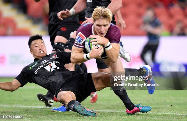 Tate McDermott of the Reds scores a try during the round four Super Rugby match between the Reds and the Sunwolves at Suncorp Stadium on February 22,...