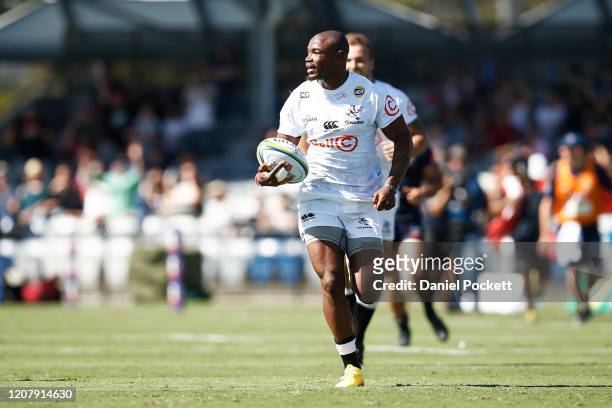 Makazole Mapimpi of the Sharks runs with the ball during the round four Super Rugby match between the Rebels and the Sharks at Mars Stadium on...