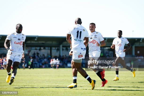 Makazole Mapimpi of the Sharks passes the ball to Curwin Bosch of the Sharks in for an unmanned try during the round four Super Rugby match between...