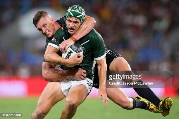Kalyn Ponga of the Maori All-Stars is tackled by Jack Wighton of the Indigenous All-Stars during the NRL match between the Indigenous All-Stars and...