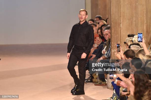 Designer Paul Andrew acknowledges applause of the audience during the Salvatore Ferragamo fashion show as part of Milan Fashion Week Fall/Winter...