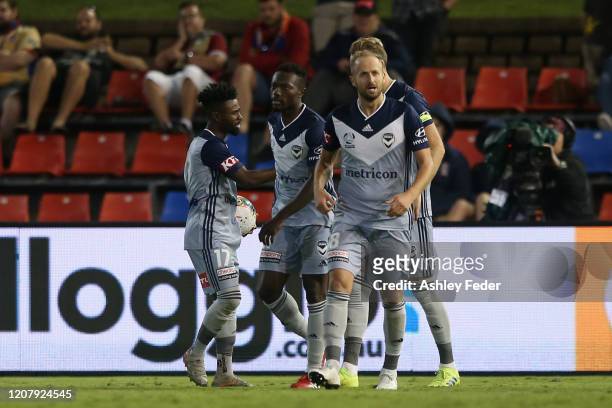 Ola Toivonen of Melbourne Victory celebrates his goal with team mates during the round 20 A-League match between the Newcastle Jets and the Melbourne...