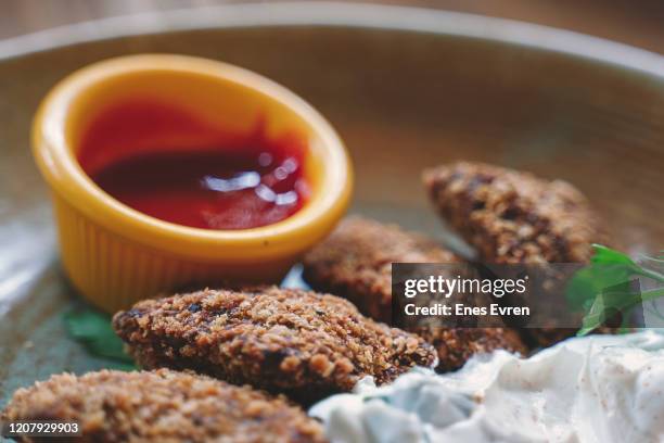 falafel, a classic middle eastern appetizers with sauce - street food middle east stock pictures, royalty-free photos & images