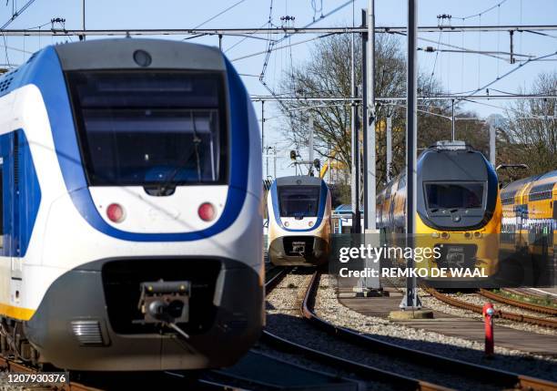 This picture taken on March 21 shows trains parked on railway parking area in Utrecht, the Netherlands. - Due to the coronavirus crisis, trains run...