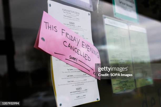 Sign saying 'This Friday Evening Cancelled' amid Coronavirus fears in Derby. British Health Ministry recorded a total of 3,983 infections, 177 death...