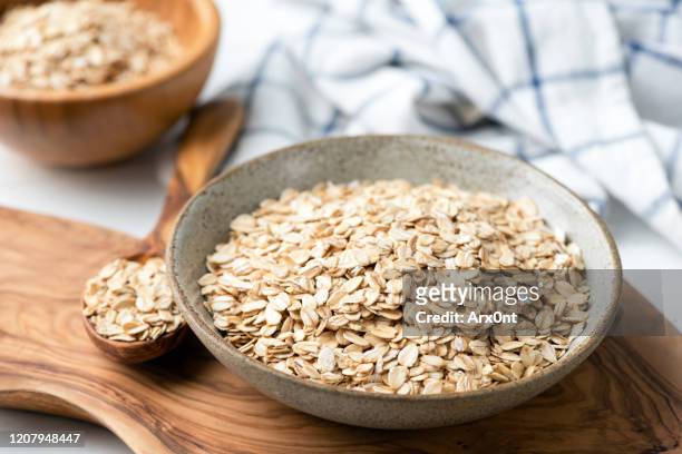 dry oat flakes, oatmeal - bran stock pictures, royalty-free photos & images