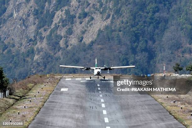 Private aircraft lands at the Tenzing-Hillary Airport in Lukla, some 140 kms northeast of Kathmandu, on March 22, 2020. - Nepal has suspended...