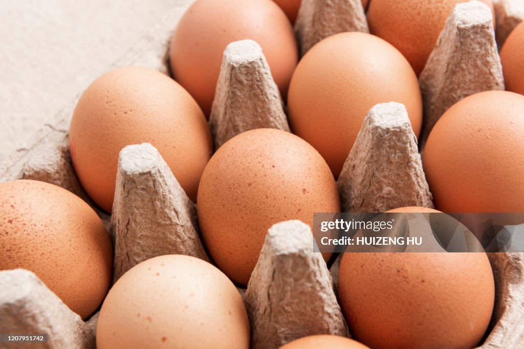 Brown eggs in an egg box, close-up