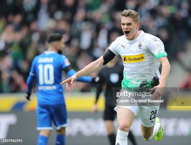 Matthias Ginter of Borussia Monchengladbach celebrates after scoring his sides first goal during the Bundesliga match between Borussia...