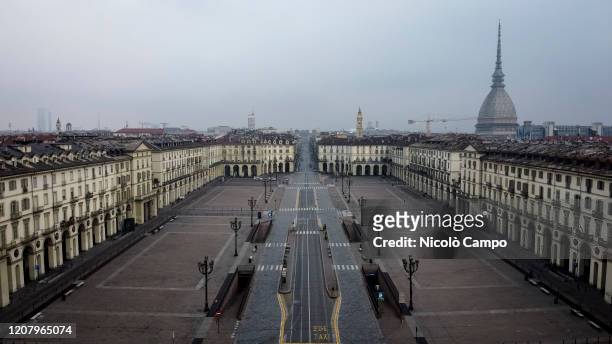 General view shows almost deserted piazza Vittorio Veneto. The Italian government imposed unprecedented restrictions to halt the spread of COVID-19...