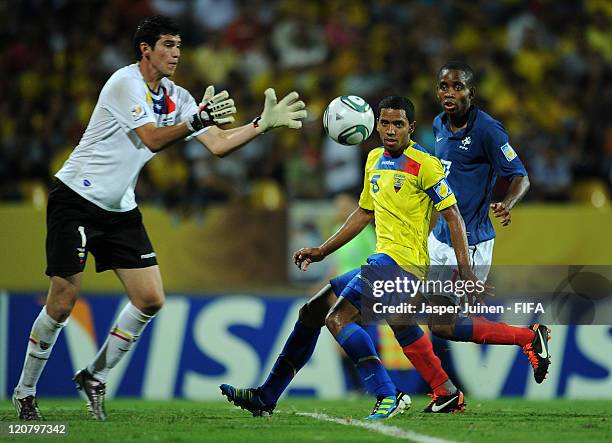 Dennis Quinonez of Ecuador and Cedric Bakambu of France watch on as goalkeeper John Jaramillo of Ecuador catches the ball during the FIFA U-20 World...