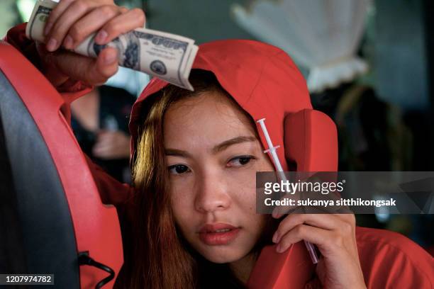 woman of drug addict buying order narcotics  by phone and paying. - marijuana arrest stock pictures, royalty-free photos & images
