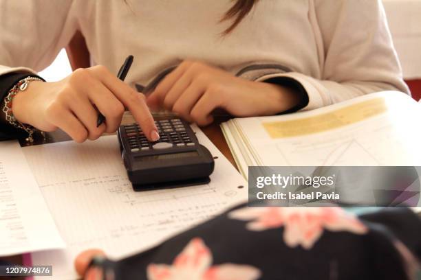 teen girl doing maths homework - math homework stock pictures, royalty-free photos & images