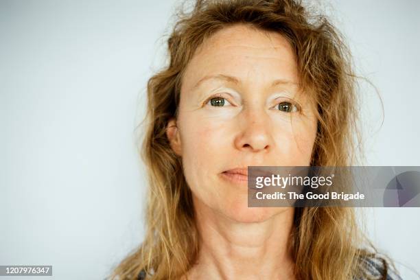 portrait of mature female on white backgroud - serio foto e immagini stock