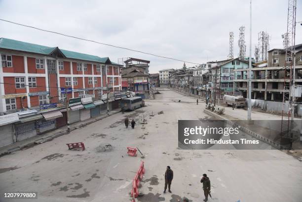 Paramilitary soldiers stand guard on a deserted street during Janta Curfew, on March 22, 2020 in Srinagar, India. PM Modi proposed a 'Janata curfew'...