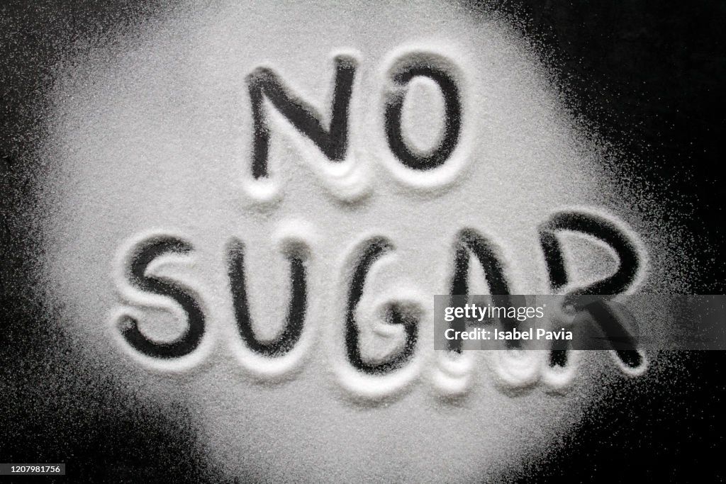NO SUGAR written on sugar background