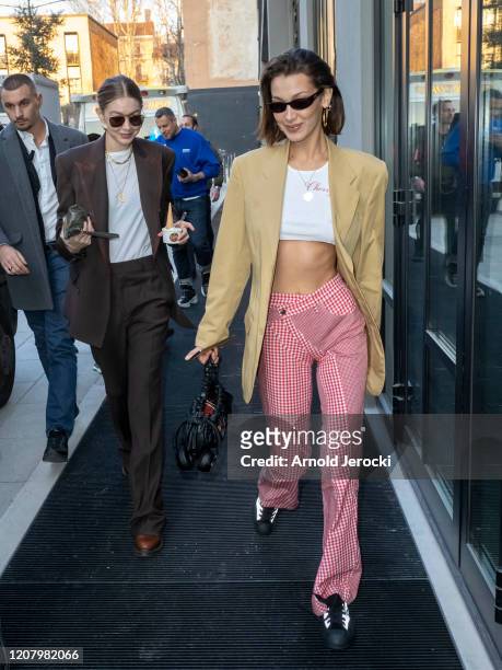 Bella Hadid and Gigi Hadid are seen during Milan Fashion Week Fall/Winter 2020-2021 on February 22, 2020 in Milan, Italy.