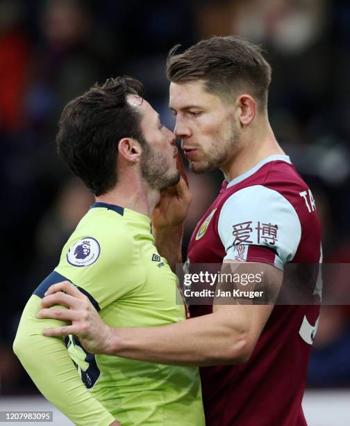 Adam Smith of AFC Bournemouth and James Tarkowski of Burnley square up to each other during the Premier League match between Burnley FC and AFC...