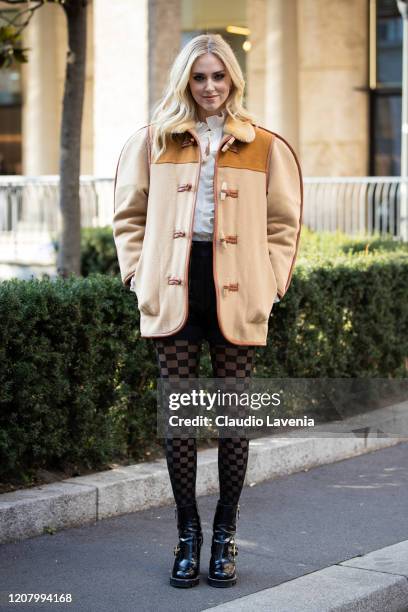 Chiara Ferragni, wearing oversize beige jacket, leather black shorts and Calzedonia checked tights, is seen outside Philosophy di Lorenzo Serafini...