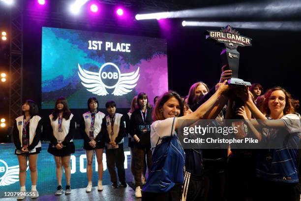 Members of Team OOB celebrate winning the League of Legends World Finals on Day Two of the Girl Gamer Esports Festival at Meydan Racecourse on...