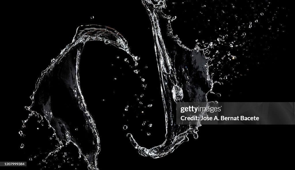 Figures and abstract forms of water on a black background.