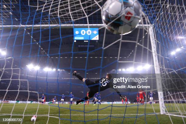 Marcel Sabitzer of RB Leipzig scores his team's first goal as Alexander Nuebel of FC Schalke 04 makes a mistake during the Bundesliga match between...