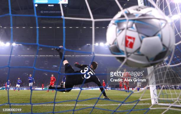 Marcel Sabitzer of RB Leipzig scores his team's first goal as Alexander Nuebel of FC Schalke 04 makes a mistake during the Bundesliga match between...