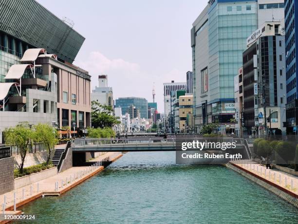 bridge crossing the hakata river in fukuoka city - fukuoka prefecture ストックフォトと画像