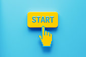Hand Shaped Computer Cursor Clicking over A Yellow Push Button: Start Written on Push Button