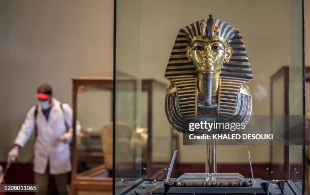Worker disinfects the gallery of the ancient Egyptian Pharaoh Tutankhamun at the Egyptian Museum in Cairo's landmark Tahrir Square amid the COVID-19...