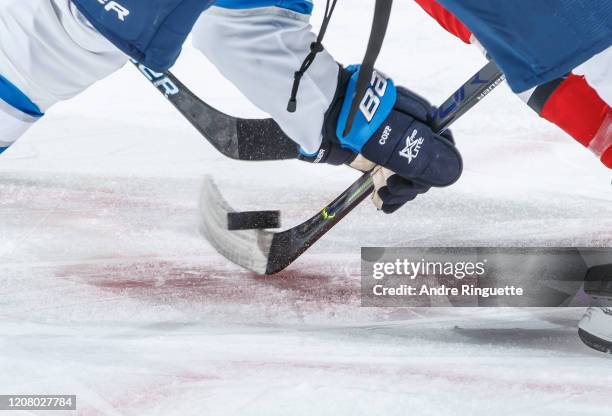 Close up of a face-off between the Ottawa Senators and the Winnipeg Jets at Canadian Tire Centre on February 20, 2020 in Ottawa, Ontario, Canada.