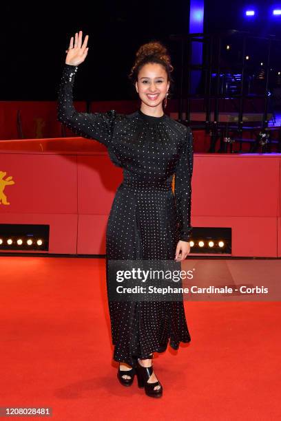 Oulaya Amamra poses at the "The Salt of Tears" premiere during the 70th Berlinale International Film Festival Berlin at Berlinale Palace on February...