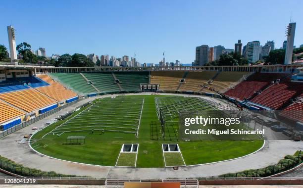 Workers set up an emergency specific makeshift hospital at Pacaembu Stadium for Coronavirus patients with a capacity of 200 beds on March 23, 2020 in...