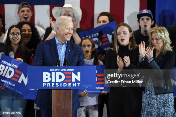 Democratic presidential candidate former Vice President Joe Biden speaks as his granddaughter Finnegan Biden and wife Dr. Jill Biden look on during a...