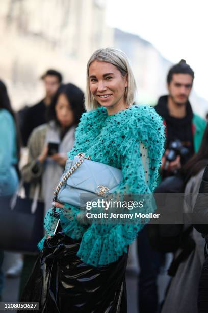 Karin Teigl wearing a Chanel bag is seen before Salvatore Ferragamo during Milan Fashion Week Fall/Winter 2020-2021 on February 22, 2020 in Milan,...