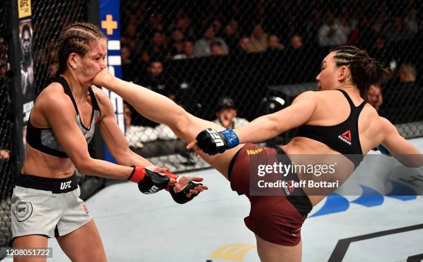 Yan Xiaonan of China kicks Karolina Kowalkiewicz of Poland in their strawweight bout during the UFC Fight Night event at Spark Arena on February 23,...