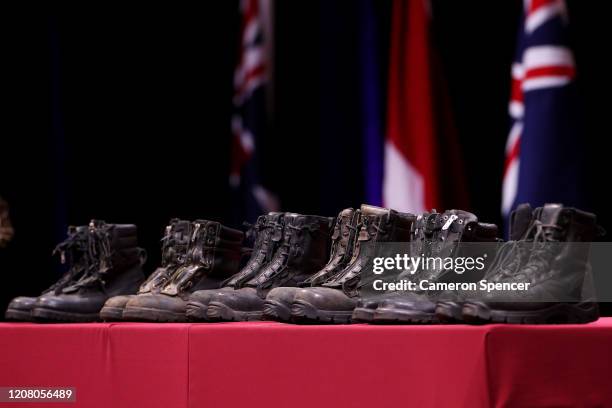 Boots representing the three NSWRFS firefighters who died in the New South Wales bushfires and the three U.S. Former service members from Coulson...