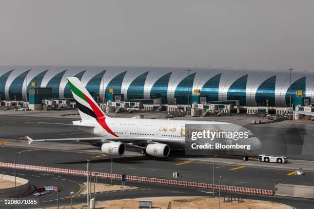 An Airbus SE A380-800 aircraft, operated by Emirates, taxis at Dubai International Airport in Dubai, United Arab Emirates, on Monday, March 23, 2020....