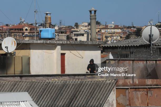 Man jogs on the roof of his building during lockdown on March 23, 2020 in Rome, Italy. As Italy extends its nationwide lockdown to control the spread...