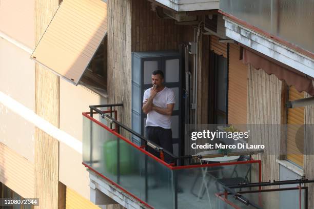 Man smokes a cigarette on his balcony on March 22, 2020 in Rome, Italy. As Italy extends its nationwide lockdown to control the spread of COVID-19,...