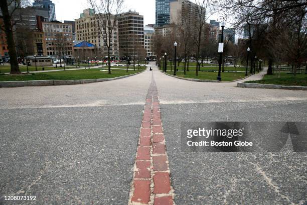 Nearly empty Freedom Trail along the Boston Common on March 23, 2020. Gov. Baker today ordered all non-essential workers to stay home and...