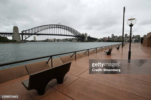 The Sydney Harbour Bridge stands across from the closed Sydney Opera House in Sydney, Australia, on Tuesday, March 24, 2020. Australia's parliament...