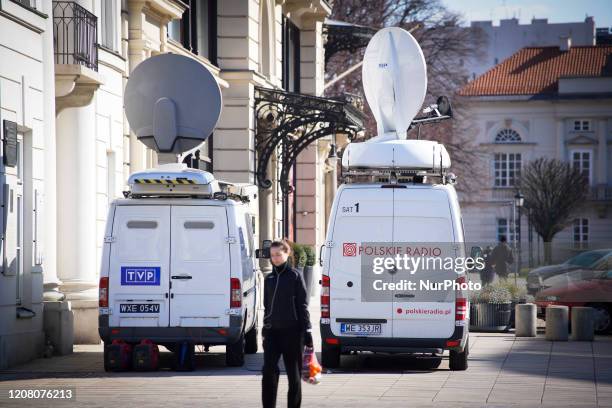 Broadcast vans of the Polish national television network TVP and Radio Polska are seen near the Presidential Palace in Warsaw, Poland on March 23,...