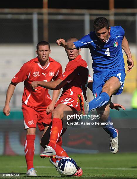 Luca Marrone of Italy U21 in action against Pajtim Kasami of Switzerland U21 during the international friendly match between Italy U21 and...