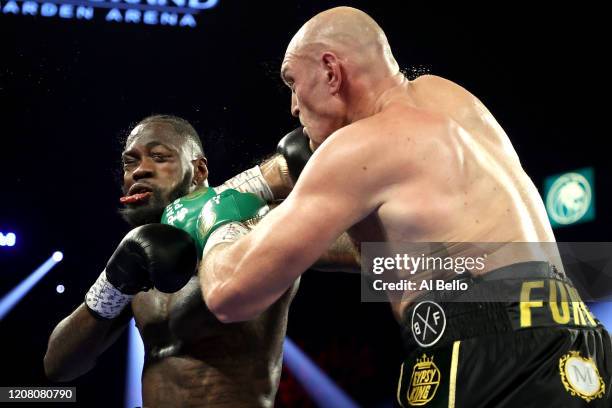 Tyson Fury punches Deontay Wilder during their Heavyweight bout for Wilder's WBC and Fury's lineal heavyweight title on February 22, 2020 at MGM...