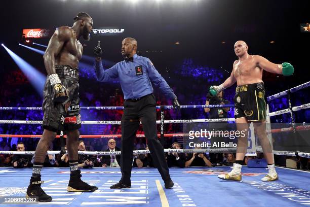 Referee Kenny Bayless speaks to Deontay Wilder during the Heavyweight bout for Wilder's WBC and Fury's lineal heavyweight title against Tyson Fury on...