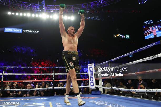 Tyson Fury celebrates his win by TKO in the seventh round against Deontay Wilder in the Heavyweight bout for Wilder's WBC and Fury's lineal...