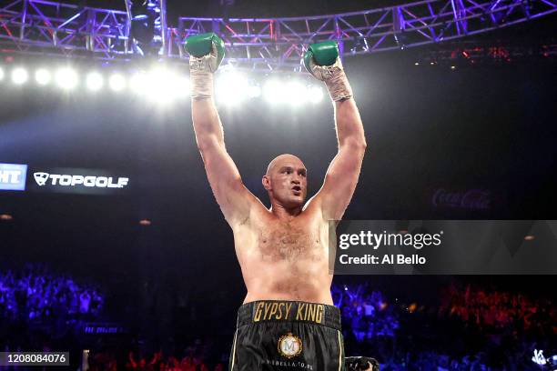 Tyson Fury celebrates his win by TKO in the seventh round against Deontay Wilder in the Heavyweight bout for Wilder's WBC and Fury's lineal...